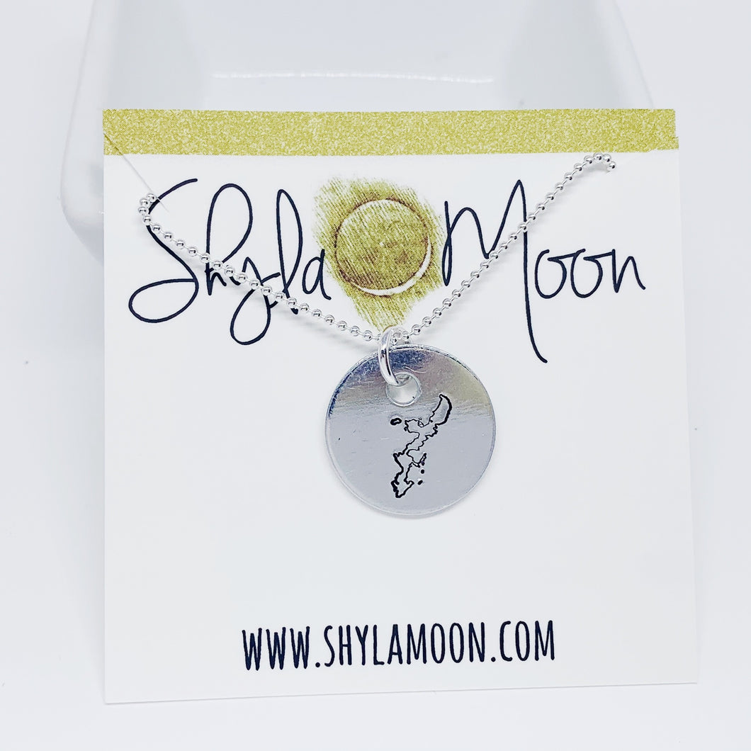 Hand stamped image of the island of Okinawa on a round shaped aluminum disc on sterling silver ball chain